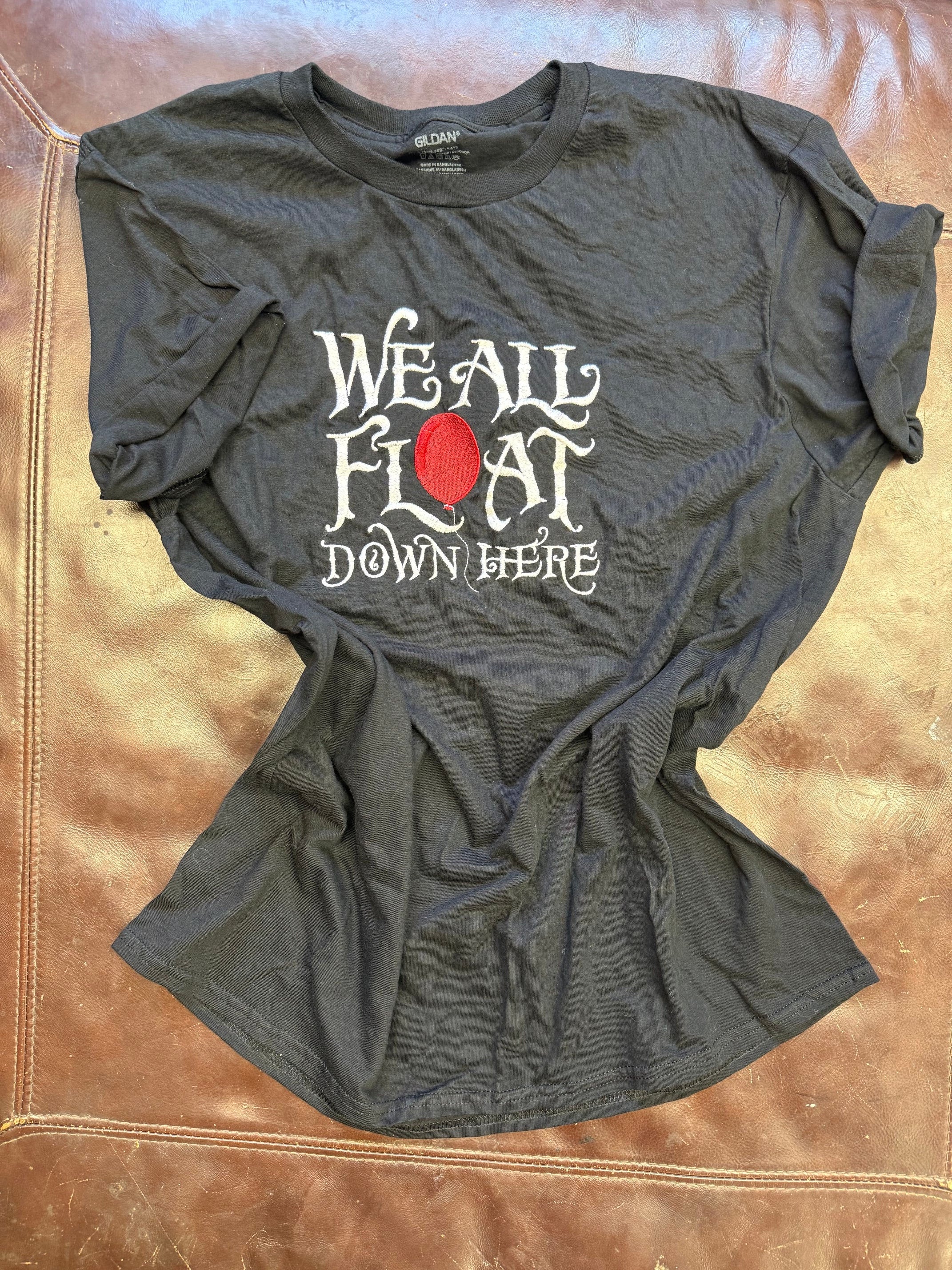 We All Float Tee